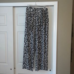 navy blue and white leopard print flowy pants with elastic band.